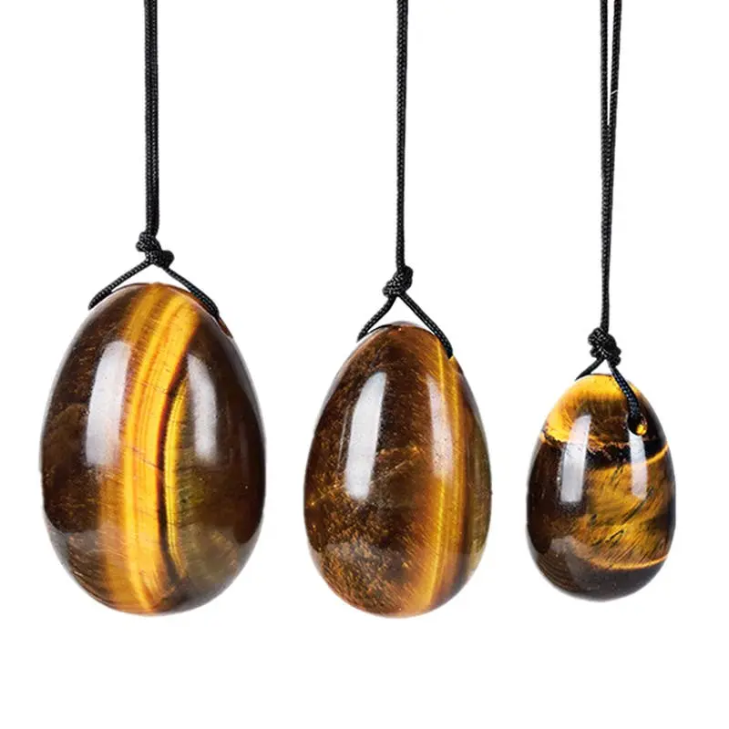 Artisans de Madagascar - Tigereye Yoni-Eier durchbohrt